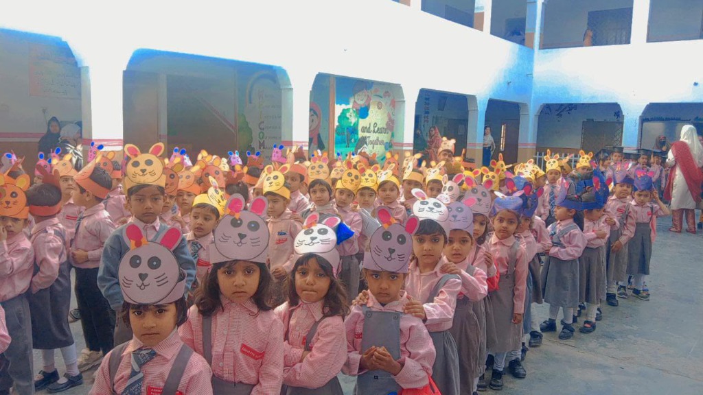 Students of Ashraf Islamia Model Public School wearing animal headbands during a school activity